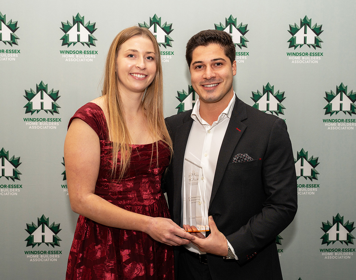 Danieka and Ilias holding the award for Best Renovation over $150,000